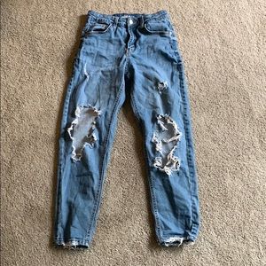 Women’s light blue ripped jeans.